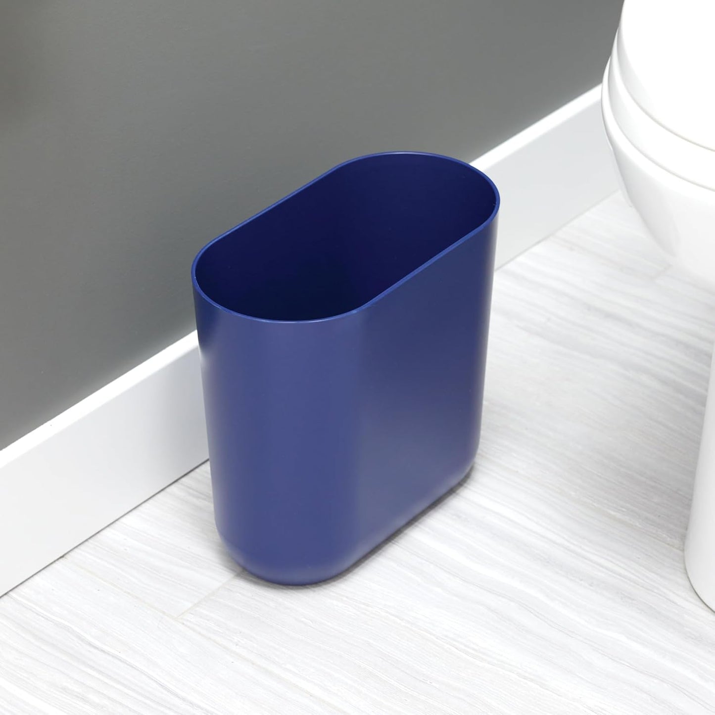 iDesign Small Oval Plastic Bathroom Trash Can - Ideal for Bathroom, Bedroom, or Office - Navy Blue